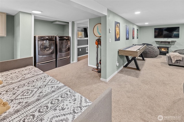 417 W 2nd St, Cle Elum, WA 98922 - bedroom with carpet, separate washer and dryer, a glass covered fireplace, baseboards, and recessed lighting