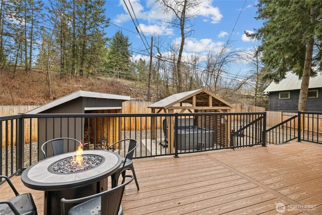 417 W 2nd St, Cle Elum, WA 98922 - wooden terrace with an outdoor fire pit, a fenced backyard, and an outbuilding