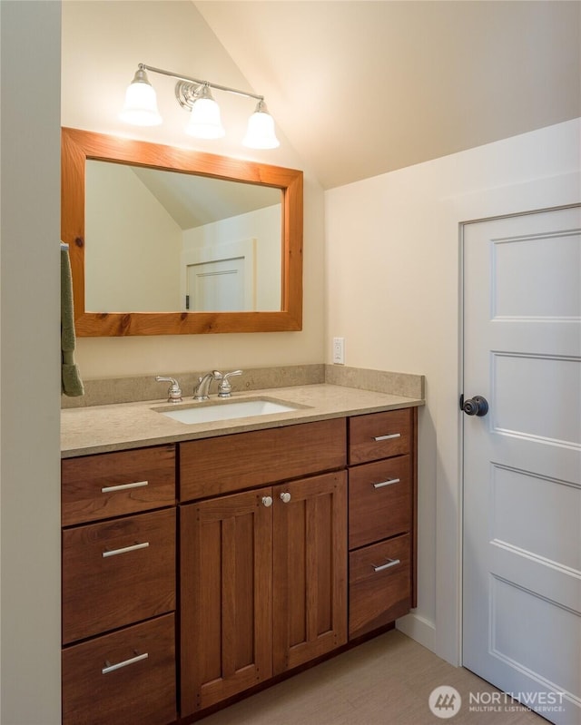 186 S Ridge Rd, Decatur Island, WA 98221 - bathroom featuring vanity and vaulted ceiling