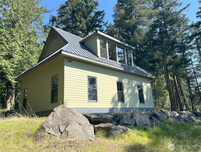 186 S Ridge Rd, Decatur Island, WA 98221 - view of home's exterior featuring a standing seam roof and metal roof