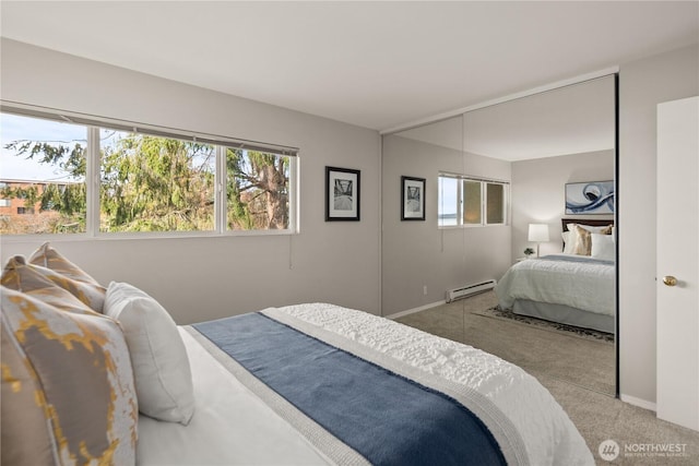 6201 Lake Washington Blvd NE Unit 206, Kirkland, WA 98033 - bedroom with a baseboard radiator, carpet floors, and baseboards
