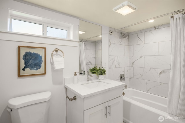 full bath featuring toilet, vanity, visible vents, and shower / bathtub combination with curtain