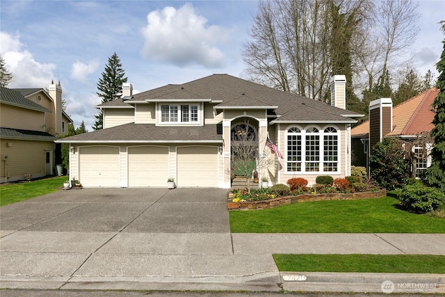 view of front of house with driveway, a front yard, a garage, and a chimney