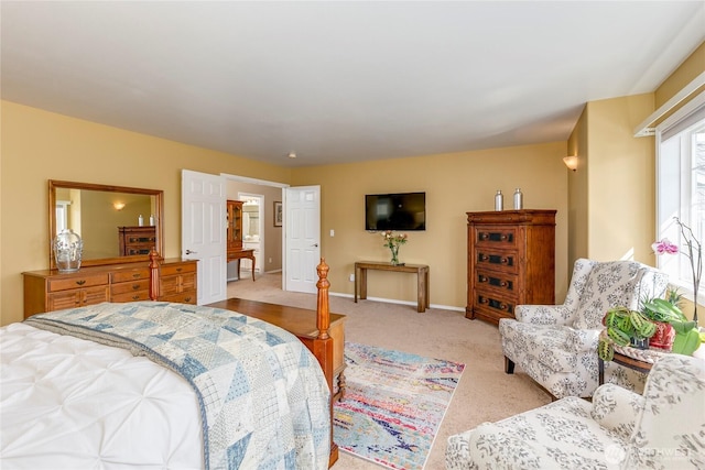 carpeted bedroom featuring baseboards