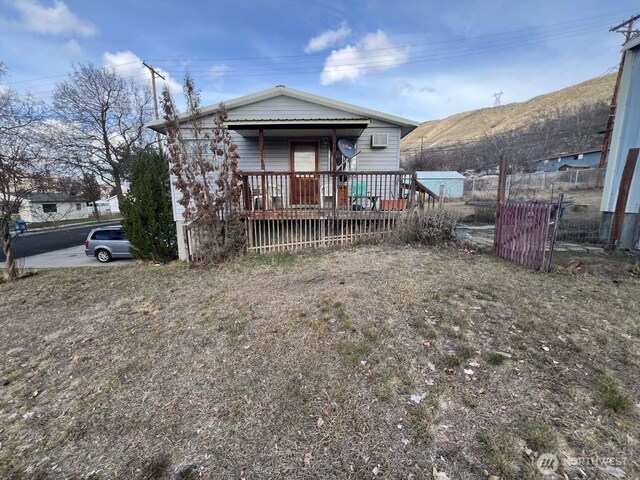back of property with fence