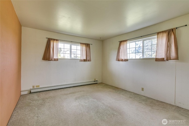 5296 Olson Rd, Ferndale, WA 98248 - spare room with baseboard heating, healthy amount of natural light, and carpet floors