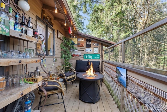 deck featuring an outdoor fire pit