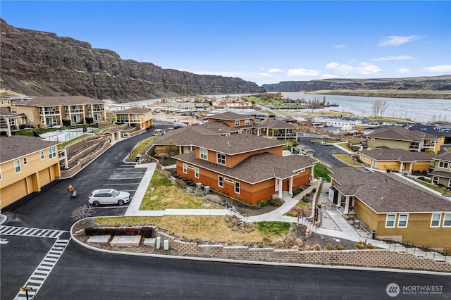 aerial view with a residential view and a water view