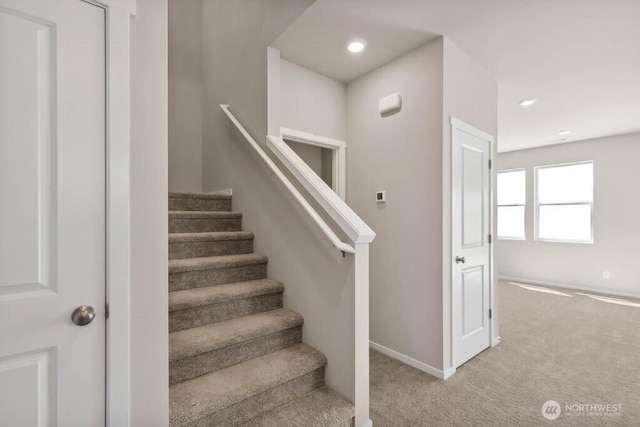 stairs with baseboards, carpet flooring, and recessed lighting