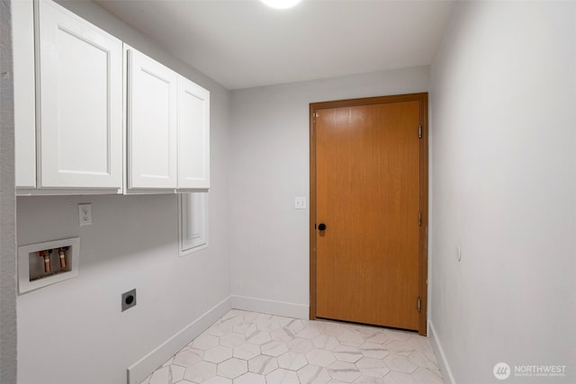 clothes washing area featuring electric dryer hookup, cabinet space, baseboards, hookup for a washing machine, and light tile patterned flooring