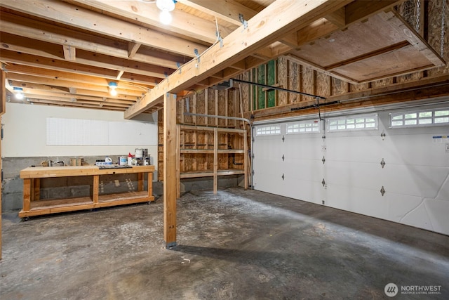 garage featuring a workshop area and a garage door opener