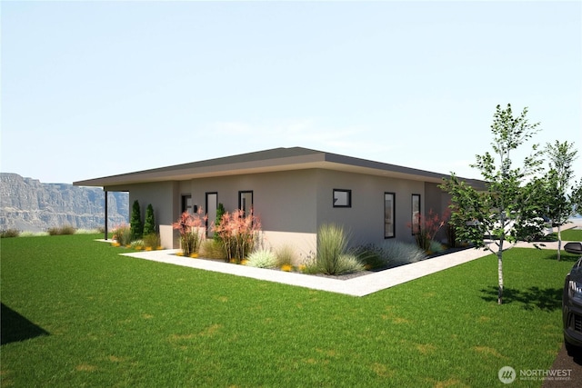 view of side of property featuring stucco siding and a yard