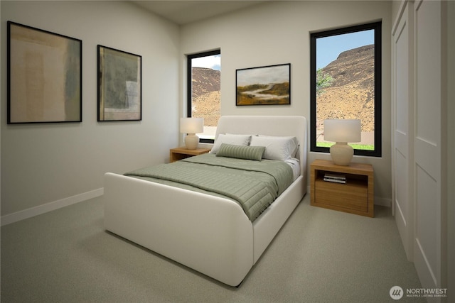 carpeted bedroom with baseboards