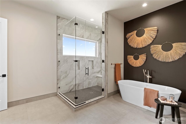 9604 Ridgeview Dr NW, Quincy, WA 98848 - full bath featuring a freestanding bath, a marble finish shower, baseboards, and recessed lighting
