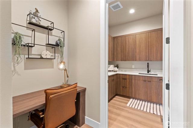 9604 Ridgeview Dr NW, Quincy, WA 98848 - bar with a sink and light wood-style flooring