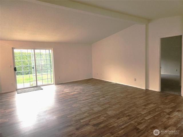 empty room with baseboards, lofted ceiling with beams, and dark wood-style flooring