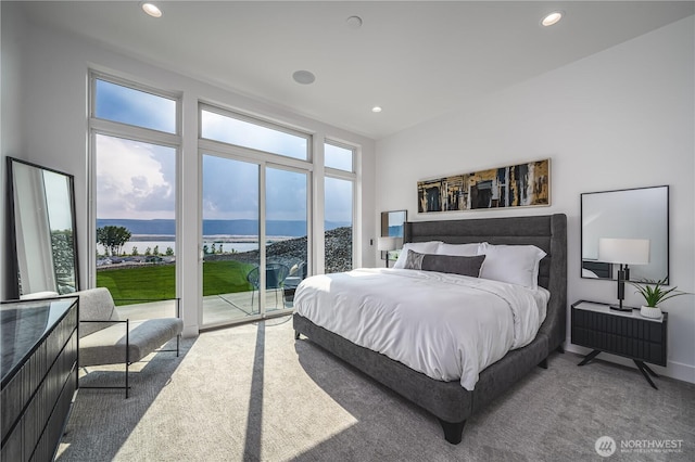 bedroom featuring carpet flooring, access to exterior, a water and mountain view, and recessed lighting