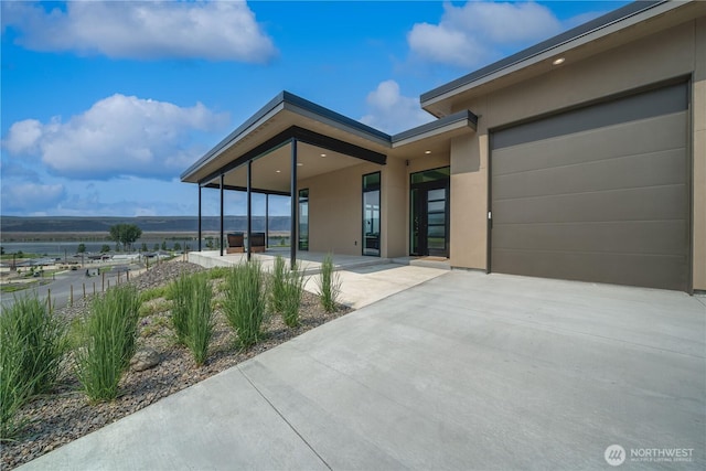 exterior space featuring concrete driveway