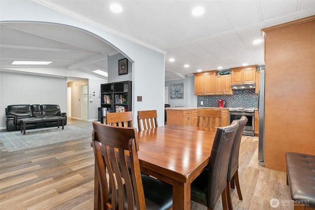 11436 SE 208th St Unit 33, Kent, WA 98031 - dining room with crown molding, arched walkways, lofted ceiling, light wood-style floors, and recessed lighting