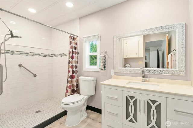 11436 SE 208th St Unit 33, Kent, WA 98031 - full bathroom featuring toilet, vanity, a shower stall, wood finished floors, and recessed lighting