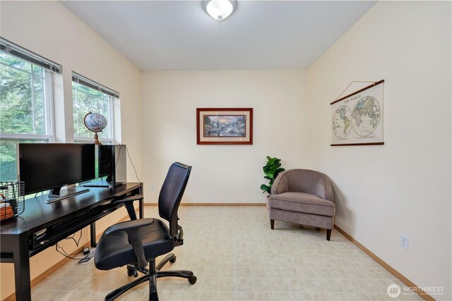 office space featuring baseboards