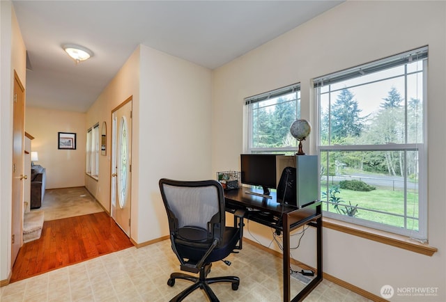 office area with wood finished floors and baseboards