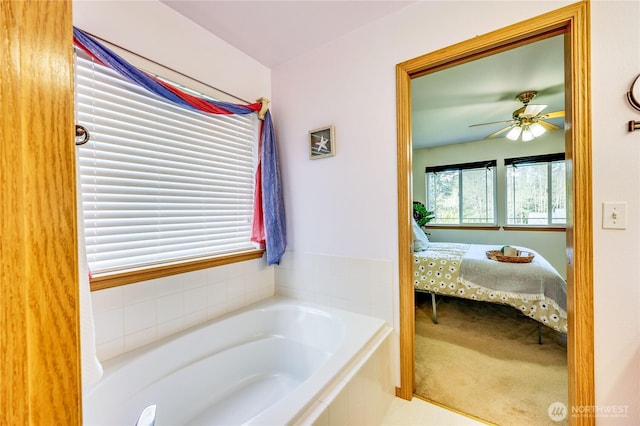 full bath with a garden tub, ensuite bath, and a ceiling fan