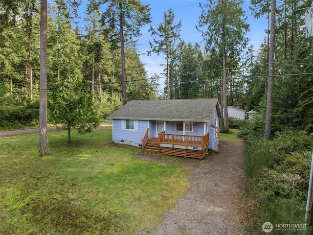 12802 Silver Dr, Anderson Island, WA 98303 - view of front facade with crawl space, a shingled roof, a front yard, and driveway