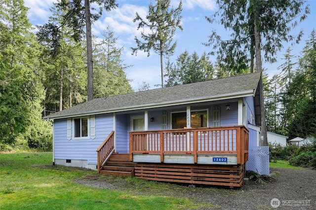 12802 Silver Dr, Anderson Island, WA 98303 - view of front facade with roof with shingles, crawl space, a front lawn, and covered porch