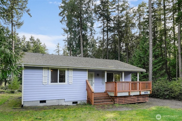 12802 Silver Dr, Anderson Island, WA 98303 - view of front facade featuring a front yard and a shingled roof