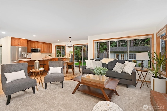 living room featuring light colored carpet and recessed lighting