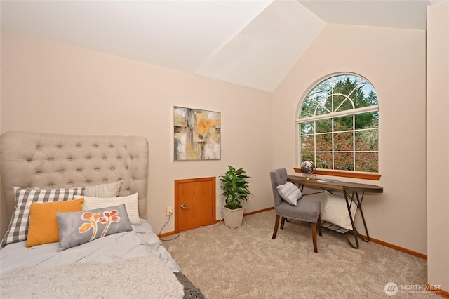 carpeted bedroom featuring vaulted ceiling and baseboards