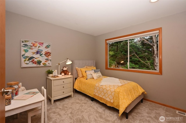 bedroom featuring carpet floors and baseboards