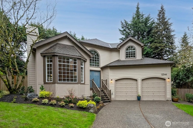 view of front of home with fence, an attached garage, a chimney, and driveway