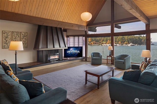 458 De Haro Ln, Friday Harbor, WA 98250 - living room with high vaulted ceiling, wooden ceiling, beam ceiling, wood finished floors, and a large fireplace