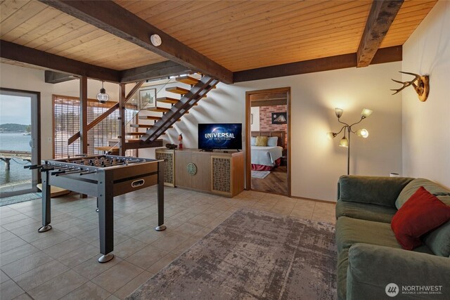 458 De Haro Ln, Friday Harbor, WA 98250 - rec room with tile patterned floors, wooden ceiling, a water view, and beamed ceiling