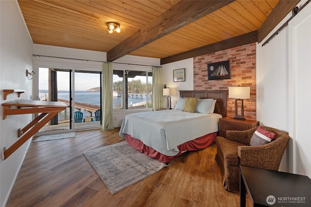 458 De Haro Ln, Friday Harbor, WA 98250 - bedroom with a water view, wood finished floors, beam ceiling, access to exterior, and wood ceiling