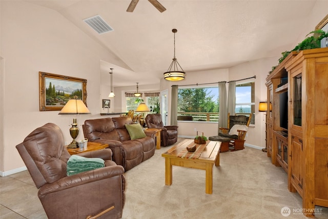 living room with high vaulted ceiling, baseboards, ceiling fan, and visible vents