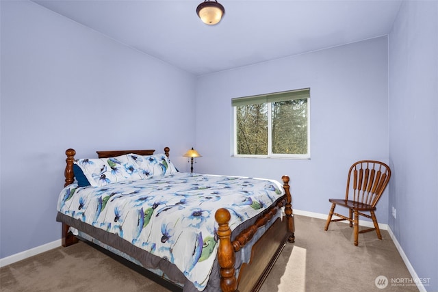 carpeted bedroom featuring baseboards