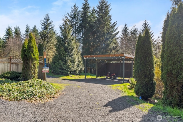 view of street featuring gravel driveway