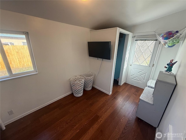 interior space featuring dark wood-style floors and baseboards