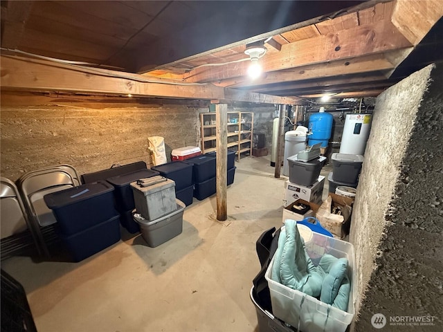 unfinished below grade area featuring water heater