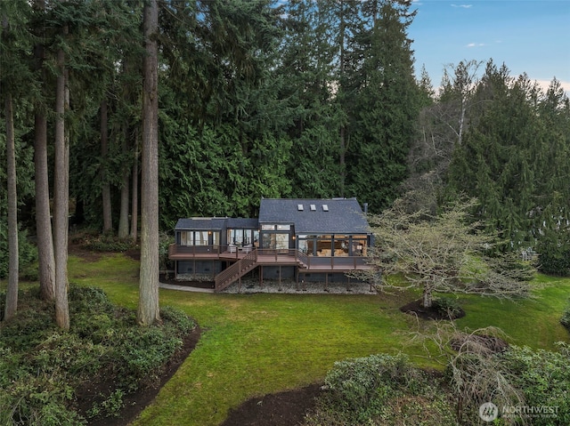 3861 Saratoga Rd, Langley, WA 98260 - back of property featuring stairway, roof with shingles, a deck, a view of trees, and a lawn