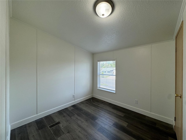 181A-B Beacon Hill Dr, Longview, WA 98632 - unfurnished room with a textured ceiling, dark wood-style floors, a decorative wall, and baseboards