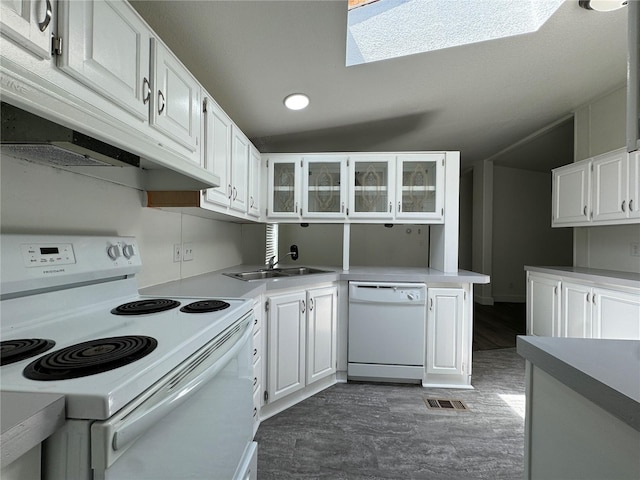 181A-B Beacon Hill Dr, Longview, WA 98632 - kitchen with white appliances, a sink, under cabinet range hood, white cabinets, and recessed lighting