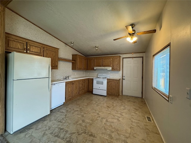 181A-B Beacon Hill Dr, Longview, WA 98632 - kitchen with white appliances, vaulted ceiling, a sink, a ceiling fan, and brown cabinetry
