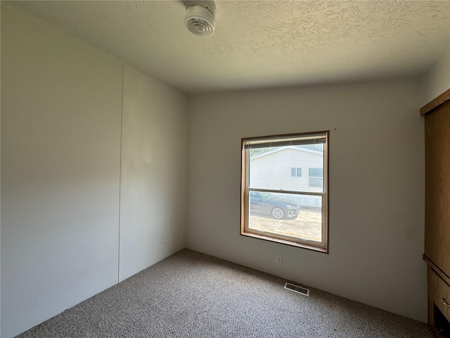 181A-B Beacon Hill Dr, Longview, WA 98632 - spare room with carpet flooring and a textured ceiling