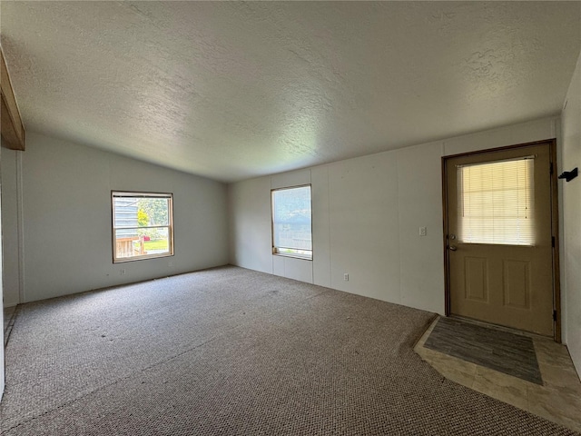 181A-B Beacon Hill Dr, Longview, WA 98632 - foyer with a textured ceiling, carpet floors, and lofted ceiling
