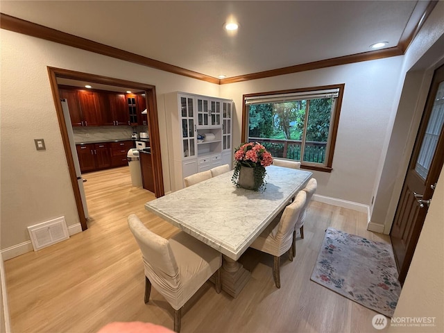 6722 River Rd E, Puyallup, WA 98371 - dining area with light wood-style flooring, ornamental molding, baseboards, and recessed lighting