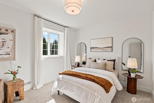 bedroom with baseboards, visible vents, and carpet flooring